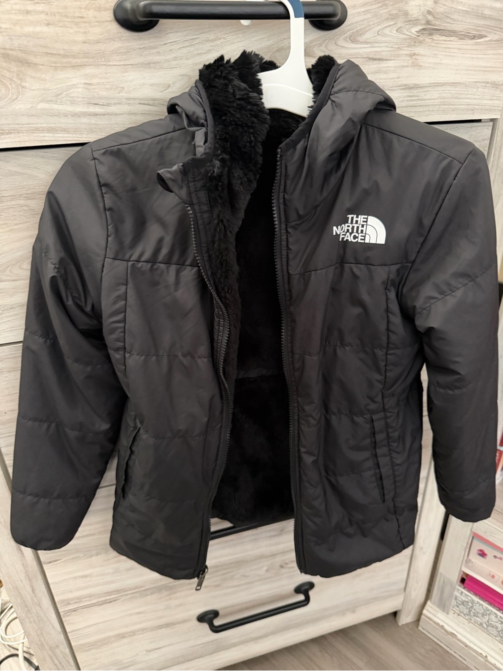 The North Face Kid’s Black Hooded Puffer Jacket with Sherpa Lining